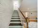 View of staircase with wooden steps and white railings and wooden trim at 3387 Passmore Rd, Rock Hill, SC 29730