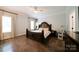 Spacious bedroom with hardwood floors, a king-size bed, and natural light at 3670 9Th Street Ne Dr # 96, Hickory, NC 28601
