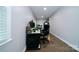 Bonus room featuring hardwood floors, a computer desk, and view of electronic drums at 3670 9Th Street Ne Dr # 96, Hickory, NC 28601