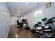 Spacious bonus room featuring hardwood floors, a desk, and electronic drums at 3670 9Th Street Ne Dr # 96, Hickory, NC 28601
