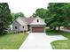 Beautiful home featuring stone accents, neutral siding, a brown roof, and a spacious two-car garage at 3670 9Th Street Ne Dr # 96, Hickory, NC 28601