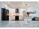 Modern kitchen featuring white cabinets, sleek black appliances, and a granite countertop at 3670 9Th Street Ne Dr # 96, Hickory, NC 28601