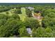 Breathtaking aerial view of the property, showcasing its proximity to the golf course and a serene lake at 3932 Rounding Run Rd, Charlotte, NC 28277