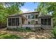 Back of home featuring large windows, deck, and screened-in porches at 3932 Rounding Run Rd, Charlotte, NC 28277