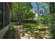 Lush backyard with mature trees and a well-maintained lawn at 3932 Rounding Run Rd, Charlotte, NC 28277