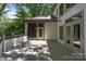 A backyard deck with a view of the outdoor trees is an ideal place to relax with friends at 3932 Rounding Run Rd, Charlotte, NC 28277