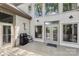 Backyard deck area featuring a grill, golf decor, and double glass doors for indoor/outdoor flow at 3932 Rounding Run Rd, Charlotte, NC 28277