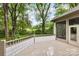 Backyard deck area overlooking a lush yard, trees, and a distant split rail fence at 3932 Rounding Run Rd, Charlotte, NC 28277