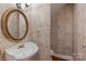 Powder room featuring pedestal sink, gold fixtures and decorative mirror at 3932 Rounding Run Rd, Charlotte, NC 28277