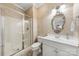 Bathroom featuring a walk-in shower, patterned wallpaper, and a white vanity with ample storage at 3932 Rounding Run Rd, Charlotte, NC 28277