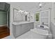 Elegant bathroom with marble countertops, soaking tub, and neutral color palette at 3932 Rounding Run Rd, Charlotte, NC 28277