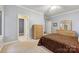 Comfortable bedroom with neutral carpet and a traditional wood dresser at 3932 Rounding Run Rd, Charlotte, NC 28277