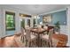 Dining room featuring a chandelier and an access door to a screened-in porch, perfect for entertaining at 3932 Rounding Run Rd, Charlotte, NC 28277
