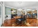 Dining room featuring hardwood floors, neutral paint colors, and a view into the kitchen at 3932 Rounding Run Rd, Charlotte, NC 28277