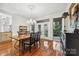 Dining room with hardwood floors, chandelier, and views of the backyard at 3932 Rounding Run Rd, Charlotte, NC 28277