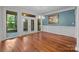 Dining room with natural light and access to the screened-in porch creates a cozy space for meals at 3932 Rounding Run Rd, Charlotte, NC 28277