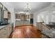 Traditional kitchen with wood floors, neutral cabinetry, granite countertops and stainless steel appliances at 3932 Rounding Run Rd, Charlotte, NC 28277