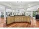 Open kitchen with large island, granite countertops, and hardwood floors at 3932 Rounding Run Rd, Charlotte, NC 28277