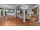 Wide-open kitchen with an island and hardwood floors is perfect for gathering and entertaining at 3932 Rounding Run Rd, Charlotte, NC 28277