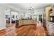 Spacious kitchen with granite countertops, wine rack, and hardwood floors at 3932 Rounding Run Rd, Charlotte, NC 28277