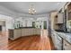 Spacious kitchen with an island and stainless steel appliances is the perfect space for cooking and entertaining at 3932 Rounding Run Rd, Charlotte, NC 28277