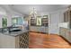 Kitchen featuring stone countertops, custom cabinets, wine rack, and stainless steel appliances offers cooking convenience at 3932 Rounding Run Rd, Charlotte, NC 28277