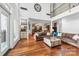 Inviting living room featuring an open floor plan, a neutral color palette, hardwood floors, and seamless access to other rooms at 3932 Rounding Run Rd, Charlotte, NC 28277