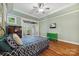 Spacious main bedroom features hardwood floors, tray ceilings, and French doors to the outdoor deck at 3932 Rounding Run Rd, Charlotte, NC 28277