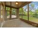 This screened-in porch with backyard access is the perfect place to relax and enjoy the outdoors at 3932 Rounding Run Rd, Charlotte, NC 28277