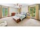 Bedroom with windows providing ample natural light and views of the lush, green yard at 40278 Nc 740 Hwy, New London, NC 28127