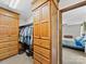 Walk-in closet with custom wood shelving and storage options, connecting to the main bedroom at 40278 Nc 740 Hwy, New London, NC 28127