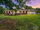 Charming brick home with lush lawn, front porch and ample parking at 40278 Nc 740 Hwy, New London, NC 28127