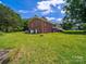 View of home with large yard, side porch and lots of parking at 40278 Nc 740 Hwy, New London, NC 28127