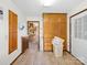 Mud room with built in cabinets, tile floors, and access to the kitchen at 40278 Nc 740 Hwy, New London, NC 28127