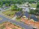 An aerial view of the community showcasing the landscaping, yard, and dark roof shingles at 405 Newstyle Way, Gastonia, NC 28056
