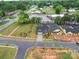 An aerial view of a neighborhood showcasing the lawn, landscaping and dark roof shingles at 405 Newstyle Way, Gastonia, NC 28056