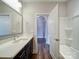 Well lit bathroom featuring modern vanity and a combination shower and bathtub at 405 Newstyle Way, Gastonia, NC 28056