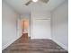 Bright bedroom with a ceiling fan, closet doors, and stylish flooring at 405 Newstyle Way, Gastonia, NC 28056