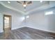 Bright room with tray ceiling, ceiling fan, hardwood floors and neutral paint at 405 Newstyle Way, Gastonia, NC 28056