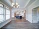 Open concept kitchen, dining and living area with hardwood flooring throughout the home at 405 Newstyle Way, Gastonia, NC 28056