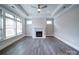 Bright living room features a fire place, large windows, and stylish flooring at 405 Newstyle Way, Gastonia, NC 28056