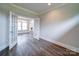 Room showcasing an open doorway with glass french doors, and hardwood flooring at 405 Newstyle Way, Gastonia, NC 28056