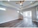 Spacious room with tray ceilings, recessed lighting, and hardwood flooring at 405 Newstyle Way, Gastonia, NC 28056