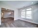 Well-lit living room with hardwood floors and large windows for natural light at 405 Newstyle Way, Gastonia, NC 28056