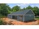 Back of home featuring gray siding and white trim, lots of windows at 415 Dogwood Ln, Statesville, NC 28625