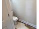 A view into the home's bathroom, showing an installed toilet and white walls at 415 Dogwood Ln, Statesville, NC 28625