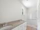 Well-lit bathroom featuring a granite countertop and modern fixtures at 415 Dogwood Ln, Statesville, NC 28625