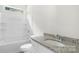 Well-lit bathroom featuring a granite countertop and modern fixtures at 415 Dogwood Ln, Statesville, NC 28625
