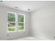Bright bedroom featuring two large windows, allowing ample natural light at 415 Dogwood Ln, Statesville, NC 28625
