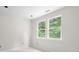 Bright bedroom featuring two large windows, allowing ample natural light at 415 Dogwood Ln, Statesville, NC 28625